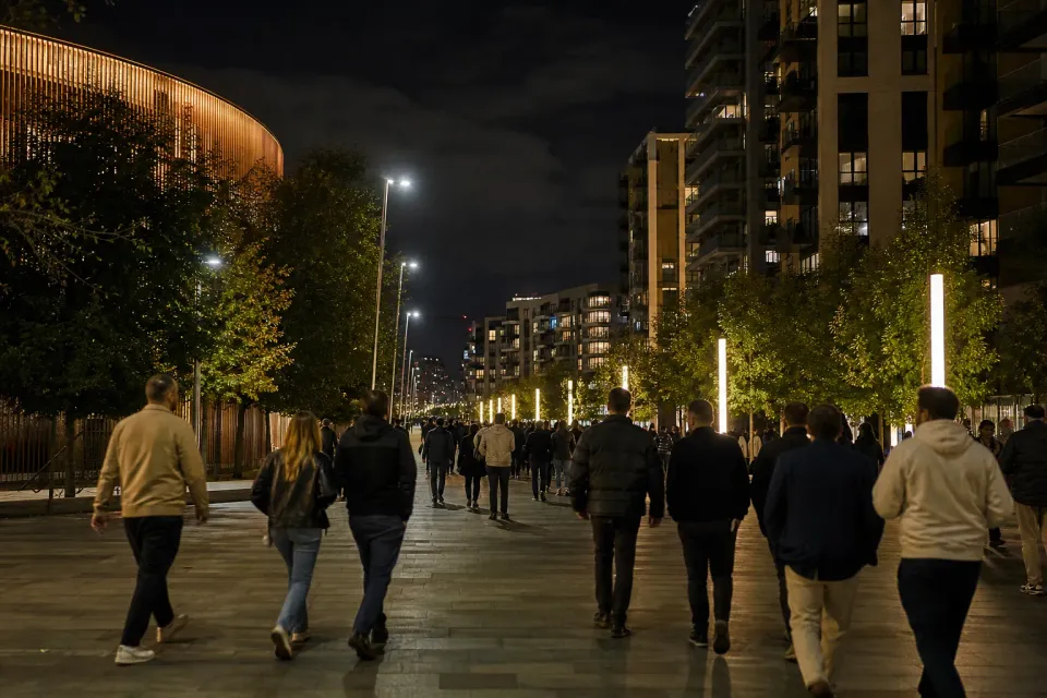 Concertgoers walking from OVO Arena Wembley toward Wembley Park transport after ITZY