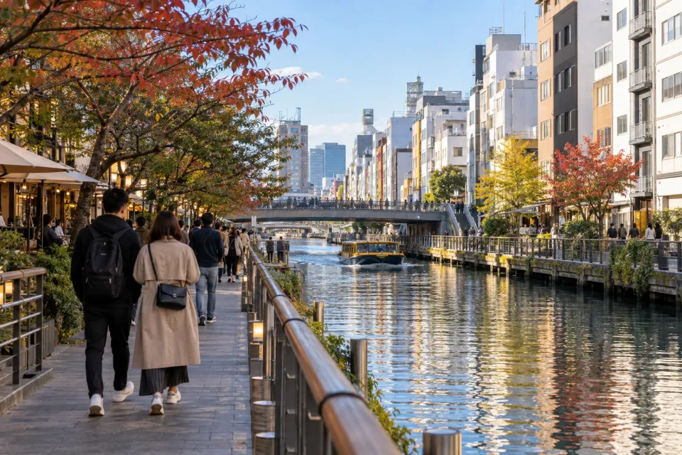 Generated travel editorial scene of a canal-side walk in Osaka's Dotonbori area